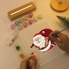 Laden Sie das Bild in den Galerie-Viewer, LED Präsentationssockel aus Holz Malen nach Zahlen 15x20 cm - Weihnachtsmann 07